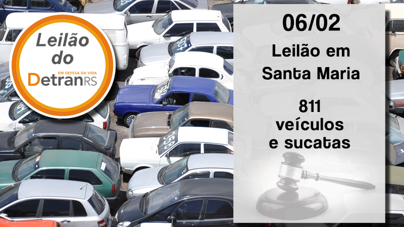 Foto de veículos em depósito. Descrição da data (06 de fevereiro), do local (Santa Maria) e número de veículos (811). Selo com assinatura de leilão do DetranRS