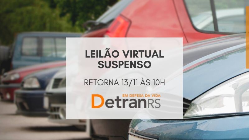 card com veículos estacionados e box na frente onde se lê leilão virtual suspenso, retorna 13/11, às 10h
