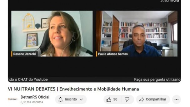 Foto horizontal colorida mostra print de tela de vídeo do YouTube com rostos de um homem e uma mulher